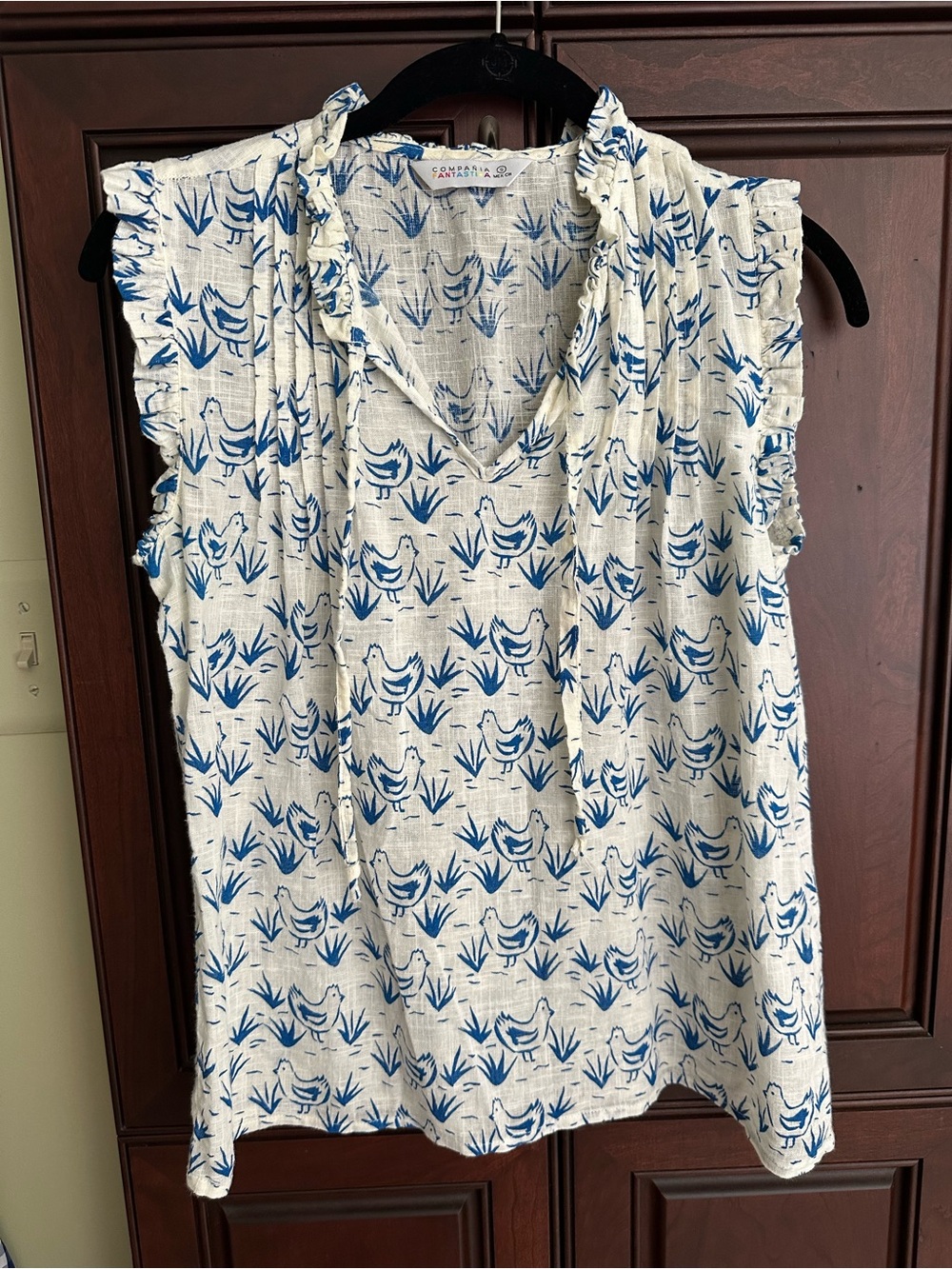 Blue & White Printed chicken motif Sleeveless V-Neck Top by Compania Fantastica